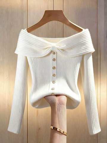 White ribbed knit long-sleeve top with bow and button detail